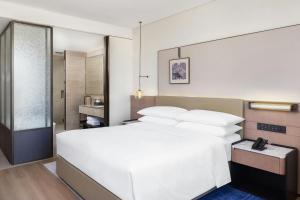 Voodi või voodid majutusasutuse Jieyang Marriott Hotel toas