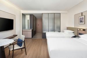 Voodi või voodid majutusasutuse Jieyang Marriott Hotel toas