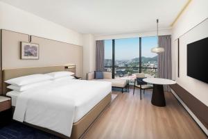 Voodi või voodid majutusasutuse Jieyang Marriott Hotel toas