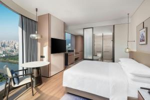 Voodi või voodid majutusasutuse Jieyang Marriott Hotel toas