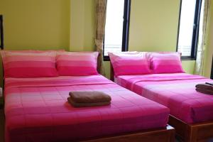 Letto o letti in una camera di Baan Mulan
