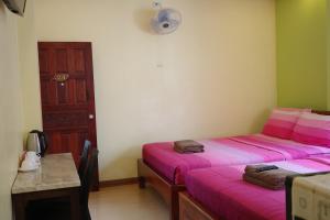 Letto o letti in una camera di Baan Mulan