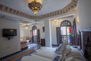 Postel nebo postele na pokoji v ubytování Riad Salam Fes