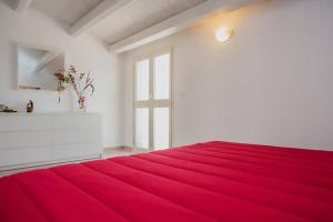 Tempat tidur dalam kamar di La Giara - holiday apartments