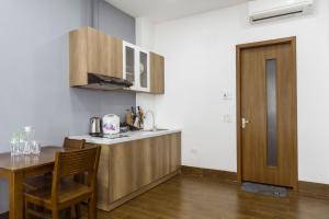 Kuchyň nebo kuchyňský kout v ubytování THE LIGHT APARTMENT