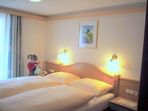 Postel nebo postele na pokoji v ubytování Hotel Gasthof Islitzer