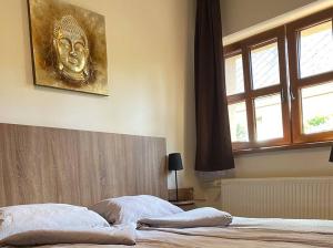 Postel nebo postele na pokoji v ubytování Shubu Zen Vendégház