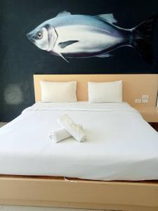 Postel nebo postele na pokoji v ubytování GO INN Aonang Beach โกอินน์ อ่าวนาง