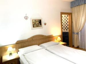 Postel nebo postele na pokoji v ubytování Bed & Breakfast SISSI