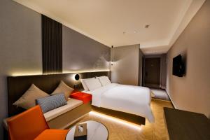 Voodi või voodid majutusasutuse Manji Yunfan Hotel Shenyang Zhongjie North Station Forbidden City Dashuaifu Branch toas