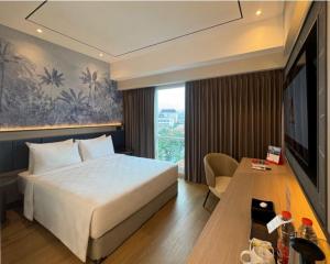 Postel nebo postele na pokoji v ubytování Swiss-Belinn Malang + 37 fotografií