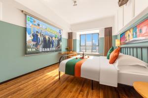 Postel nebo postele na pokoji v ubytování Happy Inn-Xinzheng International Airport Branch喜鹊愉家连锁酒店-机场店