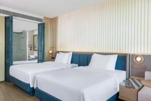 Postel nebo postele na pokoji v ubytování C&D Hotel Dongshan Zhangzhou