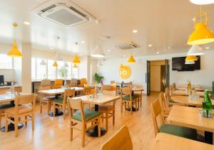 Restaurace v ubytování Bloom Hotel - Jayanagar + 26 fotografií