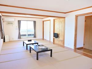 a living room with two tables and a tv at Pension B,B, Dylan - Vacation STAY 22453v in Otsu