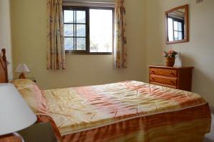 Ein Bett oder Betten in einem Zimmer der Unterkunft Casa la Ermita