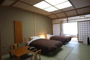 Postel nebo postele na pokoji v ubytování Nikko Senhime Monogatari + 37 fotografií