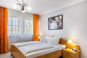 Ένα ή περισσότερα κρεβάτια σε δωμάτιο στο Europa Residenz in Thermennähe