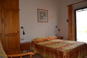Ein Bett oder Betten in einem Zimmer der Unterkunft Casa la Ermita
