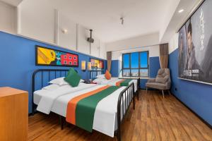 Postel nebo postele na pokoji v ubytování Happy Inn-Xinzheng International Airport Branch喜鹊愉家连锁酒店-机场店