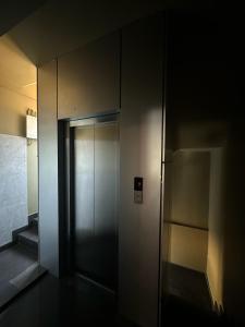an elevator in a building with its door open at Nexstay Bloomax Residency in Malappuram +50 photos
