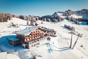 a building on top of a snow covered mountain at L'Escale (accès en télécabine) in Châtel