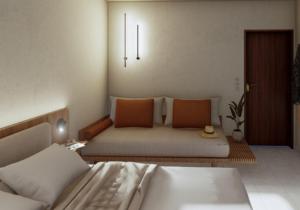a living room with two beds and a couch at Mandani Villa Luxury Apartments in Limenas +39 photos