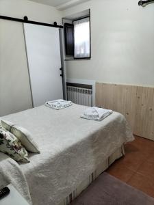 A bed or beds in a room at V.V Casa Mones