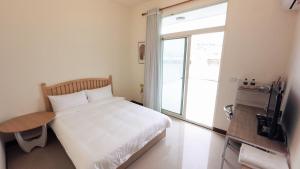 A kitchen or kitchenette at Yearning Homestay
