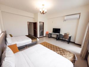 A bed or beds in a room at Yearning Homestay