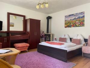 Posteľ alebo postele v izbe v ubytovaní Apartmany pod Troma Korunami