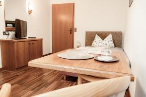 a room with a table with two plates on it at Gasthaus Anker in Konstanz