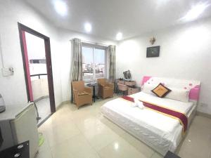 Postel nebo postele na pokoji v ubytování Đức Anh HoTel Vũng Tàu