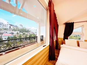 Postel nebo postele na pokoji v ubytování Hoa Chuông Villa Đà Lạt