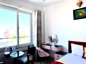 Postel nebo postele na pokoji v ubytování Đức Anh HoTel Vũng Tàu