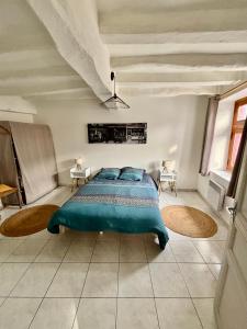 Postel nebo postele na pokoji v ubytování Appartement Situé au cœur de Brissac-Quincé