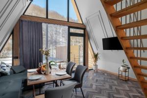 a dining room with a table and chairs at Ari Home Aghveran in Aghveran