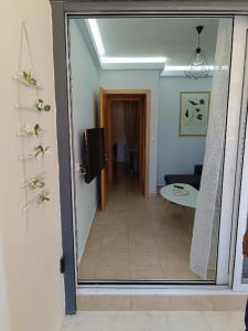 a hallway leading to a living room with a view of a room at Μαρία 4 in Káto Almirí