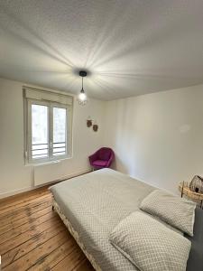 Ένα ή περισσότερα κρεβάτια σε δωμάτιο στο À deux pas