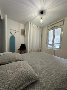 Ένα ή περισσότερα κρεβάτια σε δωμάτιο στο À deux pas