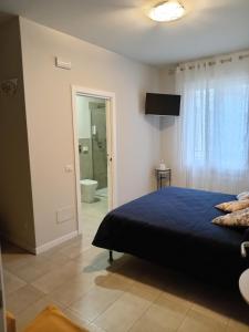 Postel nebo postele na pokoji v ubytování Il Trovatore Rooms