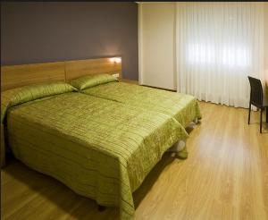 Postel nebo postele na pokoji v ubytování Madarian