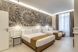 Ένα ή περισσότερα κρεβάτια σε δωμάτιο στο Relais Marco Polo