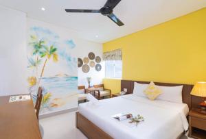 Postelja oz. postelje v sobi nastanitve Doha Central Bliss Danang Hotel by Haviland