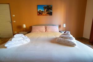 Postelja oz. postelje v sobi nastanitve Apulia Concept B&B