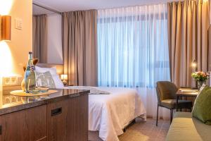 Voodi või voodid majutusasutuse Hotel DAS SAAL toas