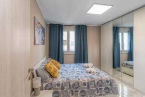 a bedroom with a bed and a large mirror at Alloggio turistico metro C in Borghesiana 