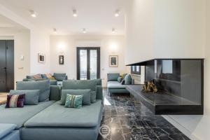 a living room with a couch and a fireplace at Estay - Biora Hospitality in Serri