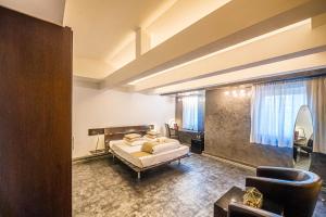 Postel nebo postele na pokoji v ubytování Do Stil Boutique Hotel