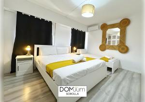 A bed or beds in a room at DOMuum Holidays - SOROLLA